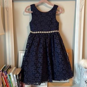Navy blue lace and tulle with satin bow and gold and pearl detail